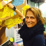 Woman in front of post-its